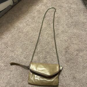 Hobo brand purse. Can be carried as wristlet or cross body with the strap.
